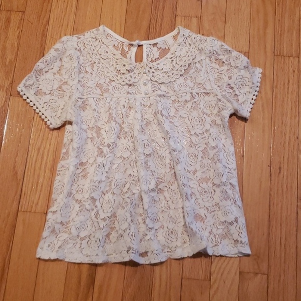 Lace Top Size S with a Pearl closure & 3 Pearl buttons in the front. Cream.